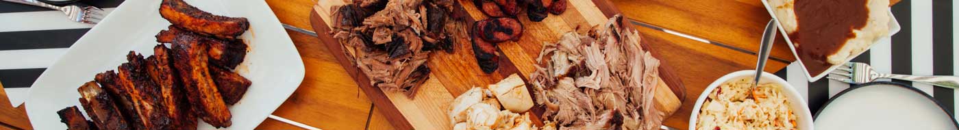 bbq display of various meats and sides Brothers BBQ Colorado